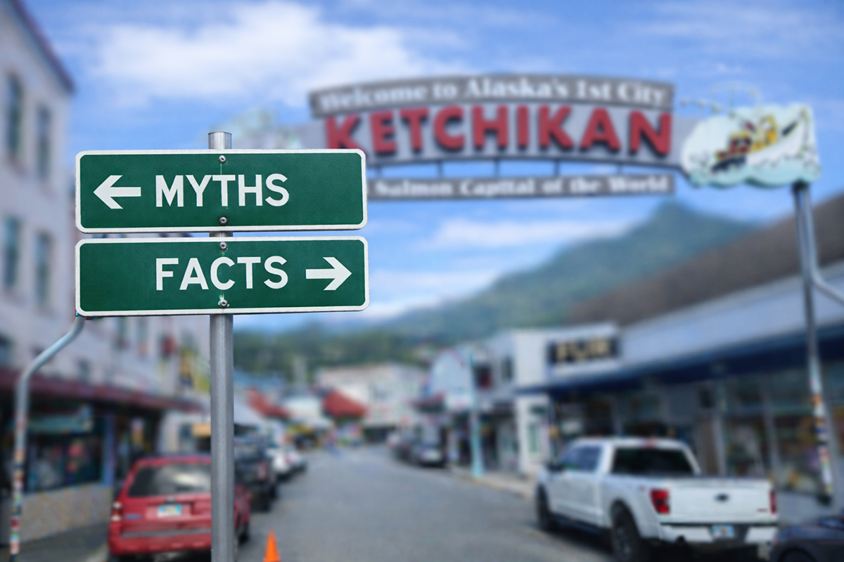 Street sign showing bed bug myths versus facts with downtown Ketchikan in the background.